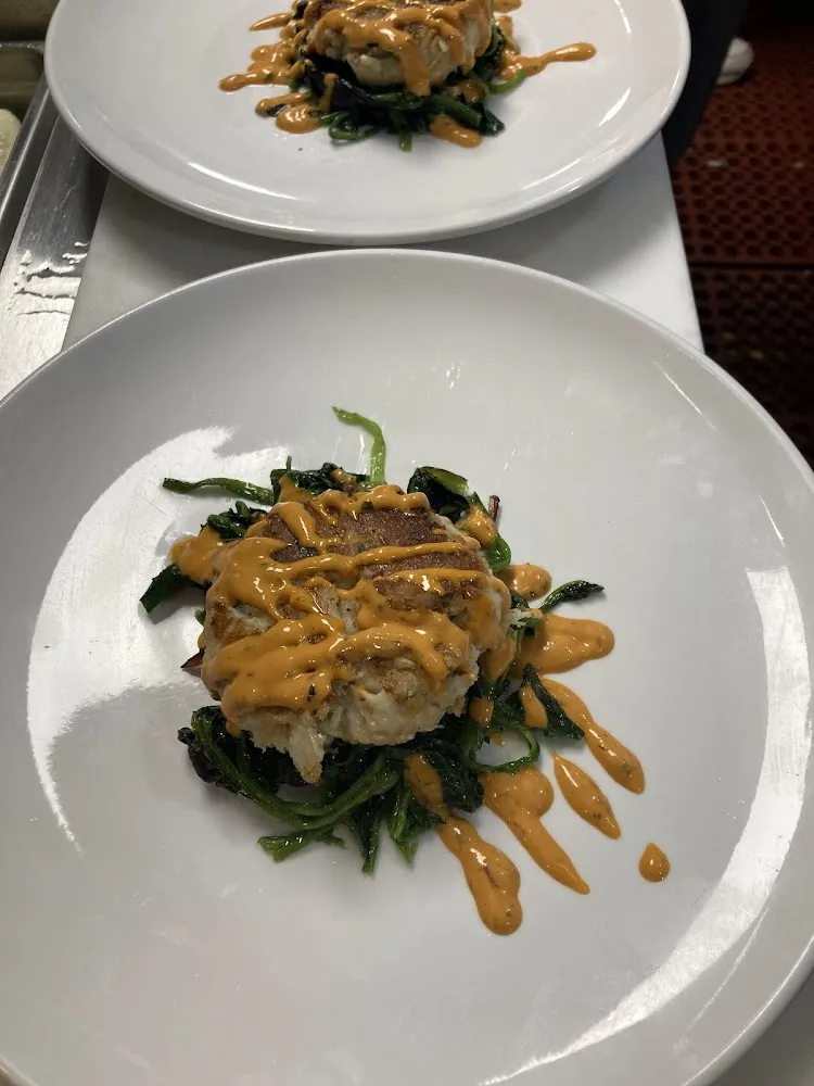 Home Made Crab Cake over Sauteed Garlic &Oil Spinach
